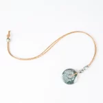 Cork necklace with large ceramic flower and small pieces