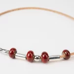 Cork necklace with reddish-orange ceramic and silver terminal - Image 3