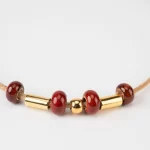 Cork necklace with reddish-orange ceramic and gold terminal - Image 3
